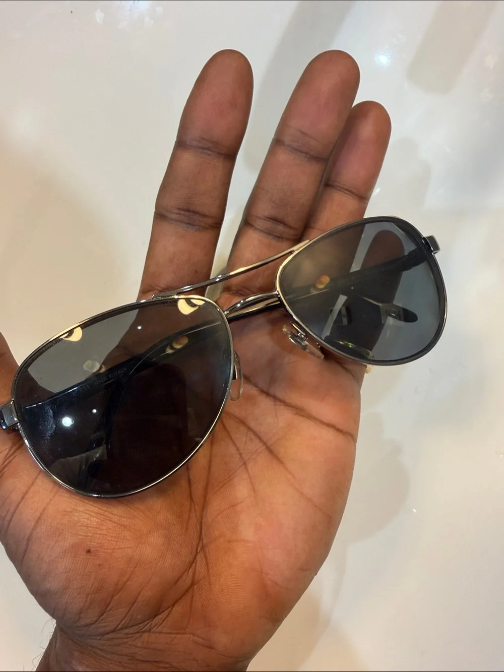 Gucci Men's Black Oval Sunglasses with Silver Accents